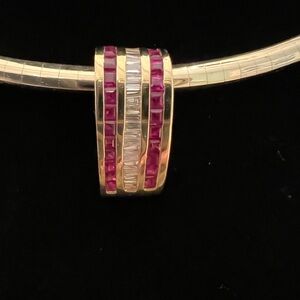 Gorgeous 14K yellow gold slide with Rubies and Diamonds inlaid in center.